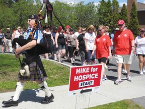 Bagpipe Dwight Grant leads the way at the annual Hike for Hospice fundraiser on Sunday. 
ERIKA GLASBERG staff photo