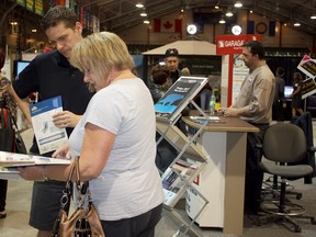 The 24th Annual Timmins Home Show was a success for organizers, participants and visitors alike. Throughout the weekend, there was something for everyone at the expo held at the McIntyre Arena. Here, Dan Dambremont of Polar Bear Windows and Door helps Timmins resident Johanne Labarre with a few inquires, while co-worker Patrick Nadeau helps customers in the background.