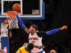 New York Knicks forward Carmelo Anthony misses a dunk over Indiana Pacers centre Roy Hibbert during  Game 1 of the NBA Eastern Conference semifinal at Madison Square Garden in New York, May 5, 2013. (REUTERS/Ray Stubblebine)