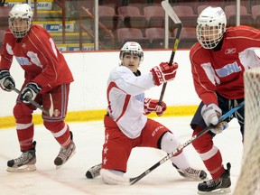 A group of Soo Greyhound hopefuls battle for the puck during the team's Spring Development Camp.