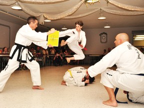 RYAN PAULSEN ryan.paulsen@sunmedia.ca

Being diagnosed with juvenile arthritis at the age of nine clearly hasn't slowed down CJ Bucholtz, now 11, who took to the air on Saturday night at the Shady Nook Recreation Centre as part of a demonstration put on by his martial arts club, Demers Taekwon-Do - Ottawa Valley. The fundraiser, part of Bucholtz's ongoing attempt to raise money and awareness of arthritis as a disease that strikes more than just the elderly, raised more than $1,000 for the Arthritis Society. For more community photos please visit our website photo gallery at www.thedailyobserver.ca.