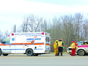 THERESA SERAPHIM/COLD LAKE SUN
Emergency crews attend to the scene of a motor vehicle collision on Highway 28 on May 4 in the afternoon. The 20-year-old driver of a white Chevy Trailblazer (centre of picture) was found ejected. RCMP are investigating to determine the cause of the collision., with assistance from the traffic reconstructionist from St. Paul. The driver, a Cold Lake resident, remains in hospital in Edmonton in a coma.