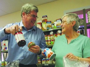 David Townsend, executive director with Southern Frontenac Community Services Corporation and volunteer Diane Dobing sort food at the SFCSC Food Bank in Sydenham. The organization is participating in the Give It Up for Hunger campaign to mark Hunger Awareness Week, which takes place May 6-10. Hunger Awareness Week is a week-long initiative that challenges Canadians to learn more about the issue of hunger, the important work of food banks and to take action.      ROB MOOY - KINGSTON THIS WEEK / FRONTENAC THIS WEEK