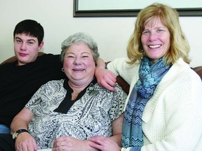 James Gordon places an arm around his mother, Carol Gordon, who is battling with lung cancer. Also shown is Sandy Whaley, client volunteer coordinator for Hospice Kingston. Carol has been fighting lung cancer with the helpful support services that are offered through Hospice Kingston.      ROB MOOY - KINGSTON THIS WEEK