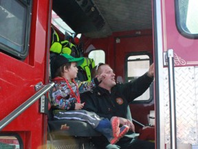 Firefighter Dan Steinke showed Ole Olson, 2, around the fire truck on May 4 outside the Canadian Tire. The Whitecourt Fire Department, along with the Alberta Enviornment and Sustatinable Resource Development wildfire management team talked to the public about spring and summer fire safety. Visit firesmart.alberta.ca for more information.
Celia Ste Croix | Whitecourt Star