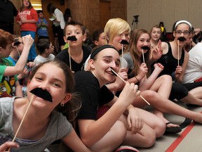 Several students at King George VI were sporting Chris Hadfield moustaches Monday May 6, 2013 as the Sarnia, Ont. school participated in Music Monday. Students watched a video created by former King George VI student and Canadian astronaut Chris Hadfield, and sang along with the song, I.S.S. (Is Somebody Singing), that he recorded with the Barenaked Ladies' Ed Robertson and a children's choir. (BLAIR TATE / FOR THE OBSERVER / QMI AGENCY)