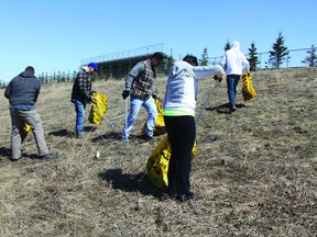 Residents participate in last year’s Pitch In cleaning campaign.