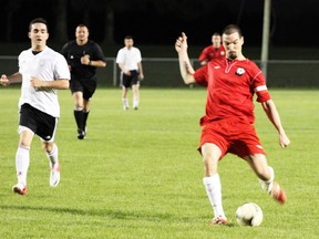 Woodstock Stallions team captain Kevin Haycock kicks Woodstock's lone goal during the first-half of their Friday night opening game in the First Division of the Western Ontario Soccer League at Cowan Park. The Stallions tied Sarnia FC 1-1.

GREG COLGAN/QMI Agency/Sentinel-Review