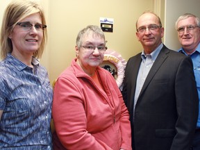 The Cochrane District Social Services Administration Board unveiled its first smoke-free residence in Timmins on Melrose Ave. on Friday. From left are CDSSAB program manager Carol Barber, tenant Sylvia Raymond, Coun. Gary Scripnick, and CDSSAB serviceperson Kevin Quinn.