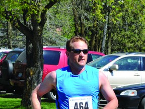 John MacMillan approaches the finish line at Sunday's California Charity Run. MacMillan's time of 41:21 earned him third place in the men's division in the 10K portion of the race. (STEVE PETTIBONE The Recorder and Times)