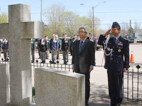 South Korea's ambassador to Canada Cho Hee-yan and defence attache Col. Lee Soo-wan lay a wreath Monday marking Canada's contribution to the Korean War. 
Elliot Ferguson The Whig-Standard