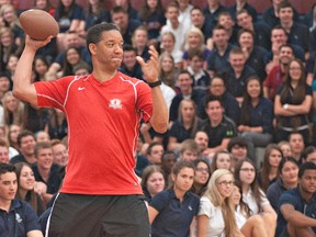 Former CFL quarterback Damon Allen gets set to throw a football during an assembly at Assumption College on Monday.  Allen later presented a trophy to the student Liam Putt, who won the 2012 Damon Allen High School Quarterback Challenge. (BRIAN THOMPSON, The Expositor)