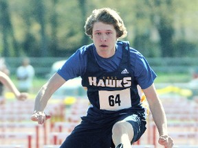 Felix Marchand of the CKSS Golden Hawks sets a meet record in the midget boys' 100-metre hurdles with a winning time of 15.22 seconds at the CK Relays on Friday at the Chatham-Kent Community Athletic Complex. (MARK MALONE/The Daily News)