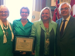 Premier Kathleen Wynne and Ontario Attorney General John Garretson present the Victim Services Award of Distinction to Sunset Country Victim Crisis Assistance and Referral Service of Kenora executive director Monika Huminuk (second from right) at Queens Park, April 25. Huminuk is joined by Sunset Country VCARS treasurer Val Sinkins in accepting the award for her work in developing a new E-learning program which has become the standardized training tool for use by volunteers and staff at victim service programs across Ontario. The presentation was made in conjunction with National Victims of Crime Awareness Week activities April 21-27.
Queens Park Handout Photo