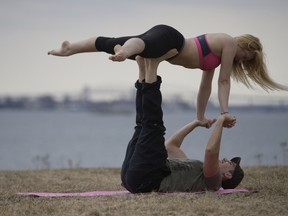 Oliva Schadel and Alo Aldabik do couples yoga on Top Sail Island recently. With the weather warming up locals are enjoying the great outdoors after a winter of being indoors.