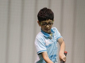 Eight-year-old Divit Gawri makes a hit during the Passport to Unity Introduction to cricket at the West End Community Centre on Friday.