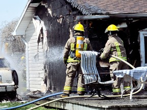 Chatham-Kent firefighters from stations 3, 4 and 5 quickly knocked down a house fire on Electric Line just east of Mitchell's Bay, On., Monday May 8 2013. No further information was available. (DIANA MARTIN/ THE CHATHAM DAILY NEWS/ QMI AGENCY)