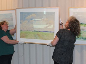 Volunteers recently hung up the new display at Sherven-Smith Art Gallery in the Kerry Vickar Centre in Melfort.