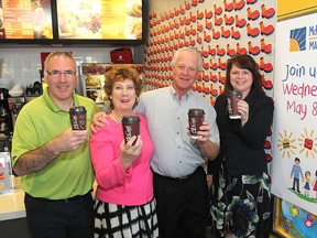 Tony Gargaro of the Boys and Girls Club of Kingston and Area, left, Karen and Ron Sutherland, owner/operators of the local McDonald's, and Liza Nelson, publisher of The Whig-Standard, gather at the Midland Avenue McDonald's.
