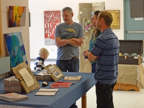 Jared Smith (left) discusses art during the 6th Annual Oxford Studio Tour Sunday afternoon at Annandale National Historic Site - No. 8 on the 21-site weekend tour. CHRIS ABBOTT/TILLSONBURG NEWS