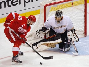 Ducks goaltender Jonas Hiller makes a save on Red Wings forward Henrik Zetterberg during Game 4 of their NHL Western Conference quarterfinal at Joe Louis Arena in Detroit, May 6, 2013. (REBECCA COOK/Reuters)