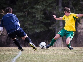 Canmore Collegiate High School Crusaders' Adrian Clavero aims to put the ball past the Foothills goaltender during soccer action at Millennium Park on May 1. Canmore won 7-1. The two teams met again on Monday with the Crusaders prevailing 2-0. Justin Parsons/ Canmore Leader/ QMI Agency