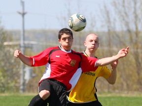 OSCVI Falcons Connor Joyce, left, and GBSS Vikings AJ Kool battle for a loose ball during their Bluewater Athletic Association senior boys soccer match up on Tuesday, May 7, 2013 in Owen Sound. (JAMES MASTERS/QMI Agency/The Sun Times)