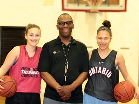 Local basketball stars Carina Hargis (left) and Tori Ivey (right) are spending a lot of time with coach Winston Ivey (middle) as they continue to prepare for the provincial team tryouts in Whitby May 18-19.