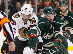 Blackhawks forward Viktor Stalberg challenges Wild forward Cal Clutterbuck during Game 4 of their NHL Western Conference quarterfinal at the Xcel Energy Center in St. Paul, Minn., May 7, 2013. (ANDY KING/Reuters)