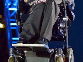 British physicist Stephen Hawking sits in the Olympic Stadium during the opening ceremony of the London 2012 Paralympic Games August 29, 2012.    (REUTERS/Toby Melville)