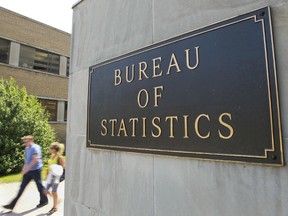 People walk out of Statistics Canada office building at Tunney's Pasture in Ottawa. (ANDRE FORGET/Postmedia Network File Photo)