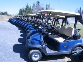 Starting line. Electric carts await the arrival of golfers at Lake of the Woods Golf and Country Club for the onset of the 2013 season expected to get underway by the middle of next week. Meanwhile, golfers at Beauty Bay Golf Course will tee off on opening day, Saturday, May 11.
REG CLAYTON/Miner and News