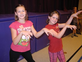 Grade 5 students, Larissa Hare and Emmalee Dejonghe, used their best Thriller moves during a dance-a-thon at Our Lady of LaSalette on Monday. The dance-a-thon was held to raise money for the Heart and Stroke Foundation of Canada. (SARAH DOKTOR Delhi News-Record)