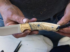 George Roberts shows off his Kamloops Knife and Gun Show award winning knife.