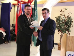 Jean-Luc Brousseau was one of the honoured guests at the Board of Trade's AGM for his volunteerism in the community. Keven Robin, presenting Mr. Brousseau (left) with his polar bears.