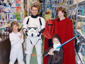 Brandon Fletcher, manager of Debye’s Pet World, his wife Liz, along with their children Gabrielle and Odin, dressed up at Star Wars characters on Saturday.     Photo by KEVIN McSHEFFREY/THE STANDARD