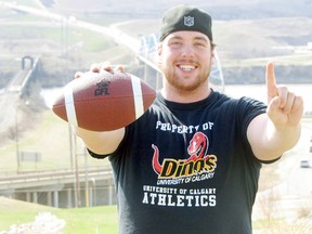 Logan Clow/R-G
Peace River native Linden Gaydosh was selected first overall in Mondayís (May 6) CFL Draft by the Hamilton Tiger-Cats. The defensive lineman played for four seasons with the University of Calgary Dinos recording 90.5 tackles, seven quarterback sacks and 14 tackles for a loss. Pictured is Gaydosh a few hours after being drafted in Peace River. See the story on Page 18.