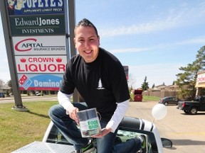 Dan Johnstone, a.k.a Can Man Dan, poses for a photo on a truck filled with food during the first-ever Cutting Out Hunger event at Detailz Hair Salon, 13708 Castle Downs Rd, last weekend. The event doubled as a fundraiser for Edmonton’s Food Bank, as well as offering free hair cuts to the public. Trevor Robb/QMI Agency