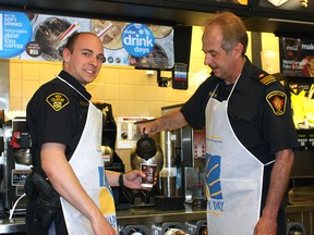KL OPP Constable Jacob Moore and KL Fire Department Platoon Chief Randy Bukovec were among the local celebrities that helped celebrate McHappy Day in Kirkland Lake
