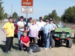 Dennis Lendrum, Ken Sokoloski, Gatetanne Sokoloski (kneeling), Ed Land, Diane Tremblay, Bob Tremblay, Theresa Land, Alger Boucher of the Espanola District Snowmobile Club one of many organizations who take part of adopt-a-street. Photo by Dawn Lalonde/Mid-North Monitor/QMI Agency