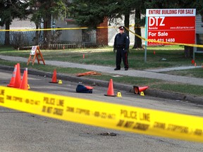 Police investigate a shooting near 97 Street and 123 Avenue Wednesday, May 8, 2013, which left a man with life-threatening injuries. (PERRY MAH/EDMONTON SUN)