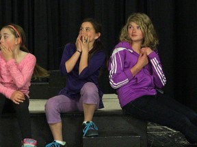 KASSIDY CHRISTENSEN PHOTO. From left, Quinn Leslie, Faith Tarry and Delaney Ellice acting shocked at a twist in the play