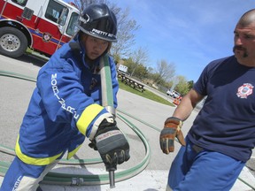 The Toronto Sun's Jenny Yuen got to train with the  Firefighter Combat Challenge Team from the Oakville Fire Department on Tuesday. (JACK BOLAND, Toronto Sun)
