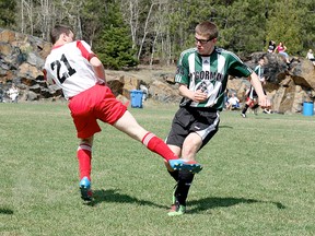 Colton Labine, right, of the O’Gorman Knights, is marked by a member of the host École secondaire MacDonald-Cartier Panthères during the MacDonald-Cartier Panthères Invitational Boys Soccer Tournament in Sudbury on the weekend. The Knights won all five games they played, including a 3-1 victory over the Confederation Chargers in the championship game.
