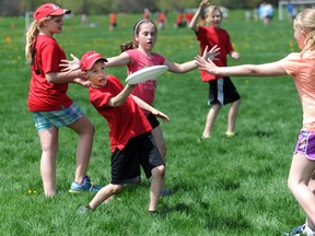 Tyler Richardson, from the St. John Fisher Lakers, attempts to toss the Frisbee down field to his fellow teammates during Ultimate Frisbee Day at Germain Park. (BLAIR TATE, For the Observer)