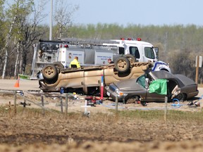 A row of five crosses rest feet away from another fatal collision at the Highway 43 and Secondary Highway 733 intersection, outside of Bezanson, Alberta, Wednesday, May 8, 2013. Two people were killed and six were sent to the local hospital following the collision. AARON HINKS/DAILY HERALD-TRIBUNE/QMI AGENCY