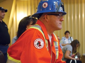 Terry Rickard, an alternate for the Dumas Mine Contracting team, watches intently as his colleagues work through a scenario at the 2013 District Mine Rescue Competitions at the Whitney Arena. Rickard was just one of about 50 people taking in the intense competition, which is being held for both the Timmins and Kirkland Lake districts until Friday. The contest is open to the public.