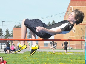 EDDIE CHAU Simcoe Reformer
Holy Trinity student Brad Dedecker clears the pole during the junior boys high jump event on Tuesday. Dedecker placed third, clearing the jump at 1.65 metres.