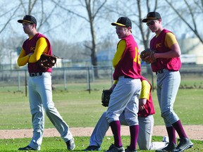 Members of the PCI Trojans chat during a pitching change in a May 8 game against Morden. (Kevin Hirschfield/THE GRAPHIC/QMI AGENCY)