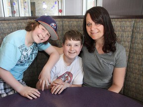 Shannon Primeau and her boys, Zack, 10, left, and Jordan, 12, volunteered their time at the Regent Street McDonald's for McHappy Day in Sudbury, ON. on Wednesday, May 8, 2013. See video at www.thesudburystar.com JOHN LAPPA/THE SUDBURY STAR/QMI AGENCY